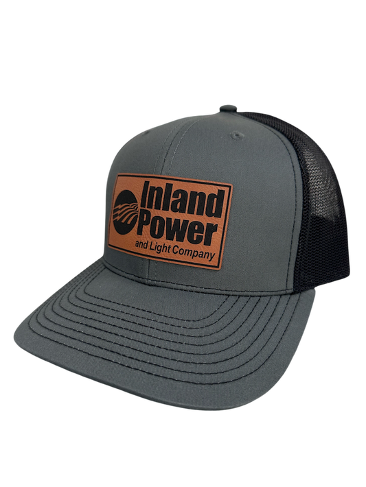 Custom leather patch trucker hat with engraved logo on Richardson 112 cap